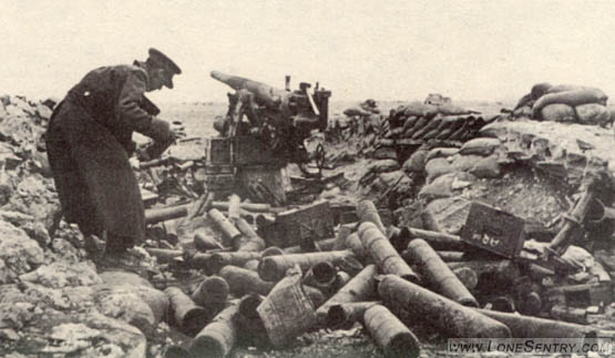 [These two pictures illustrate a German 88-mm. multipurpose gun that has been knocked out by British counterbattery fire. Notice that the hydropneumatic recuperator has been blown from its position above the tube. Also note ammunition containers in the foreground.]