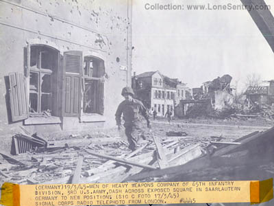 [Soldiers of the U.S. 65th Infantry Division in Saarlautern, Germany; U.S. Signal Corps Photo]